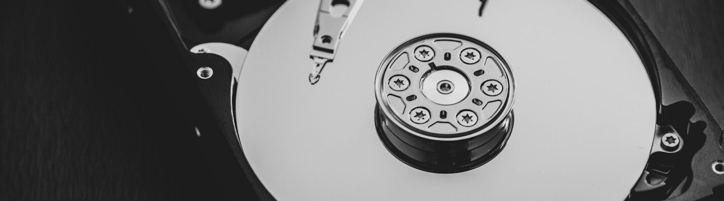 white and silver hard disk drive