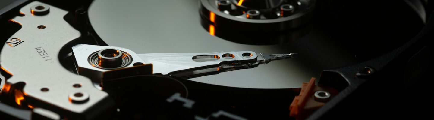 black and silver turntable on brown wooden table