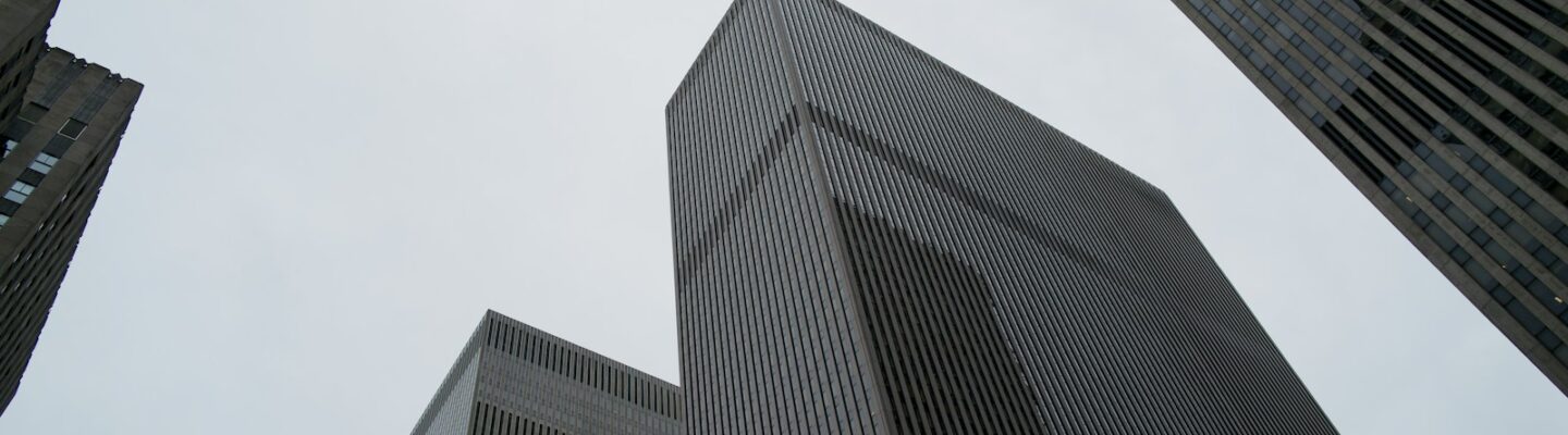 Looking up at tall buildings in a city