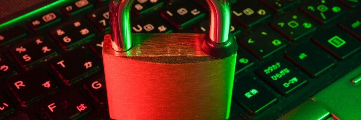 red padlock on black computer keyboard