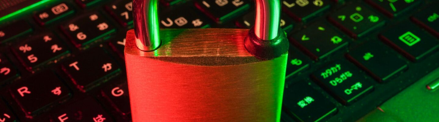 red padlock on black computer keyboard