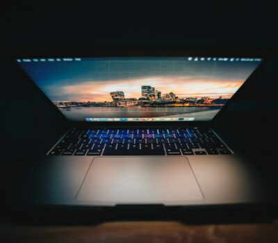 an open laptop computer sitting on top of a table