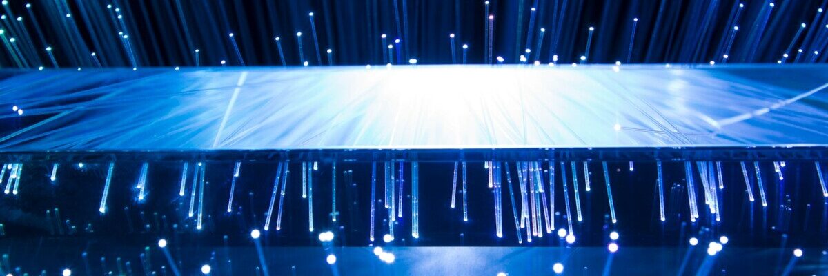 a large display of blue lights in a dark room