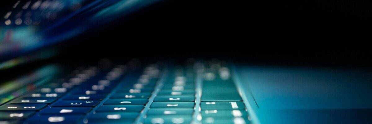 closeup photo of turned-on blue and white laptop computer