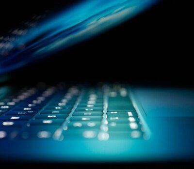 closeup photo of turned-on blue and white laptop computer