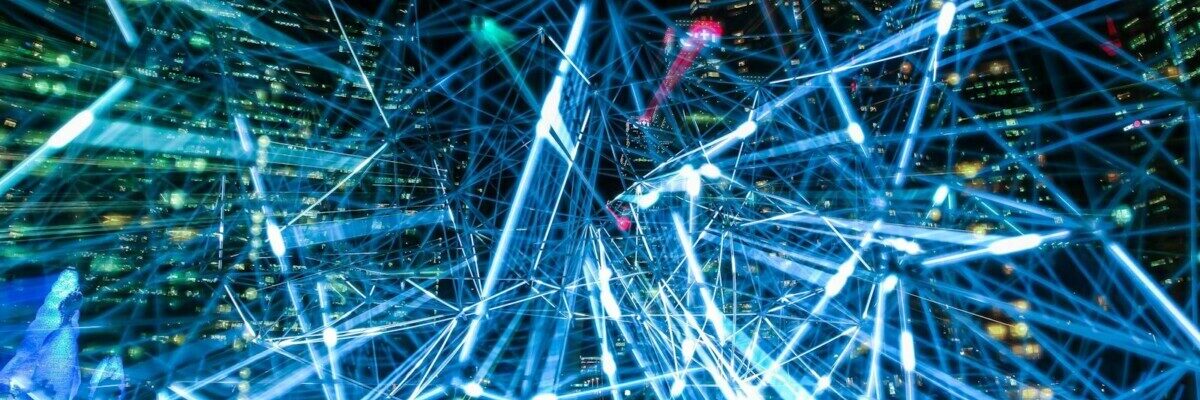 Dynamic urban scene showcasing interconnected light trails representing digital communication networks.