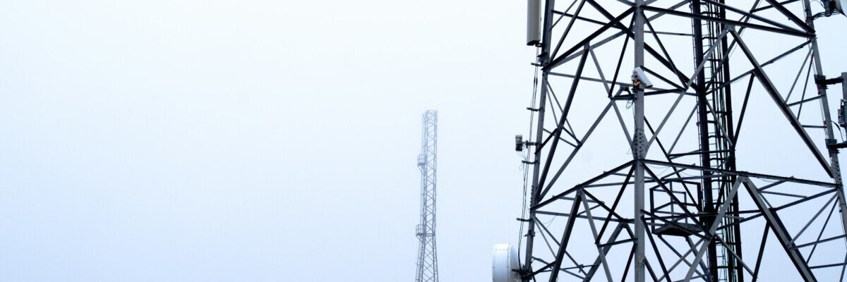 a tower with several cell phones on top of it