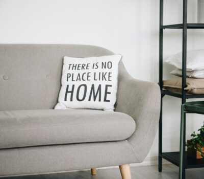 white throw pillow on gray sofa