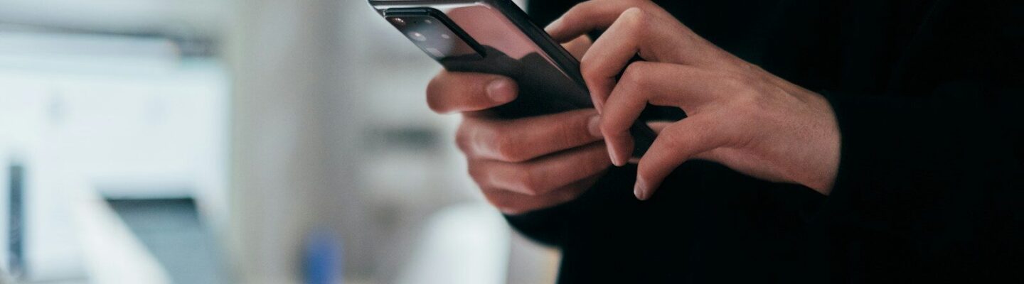 person holding black android smartphone