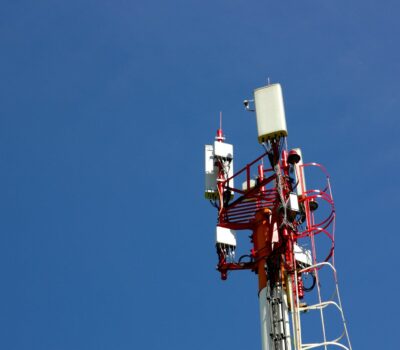 A cell phone tower with a blue sky in the background