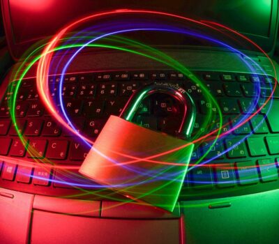 padlock on laptop with light trails